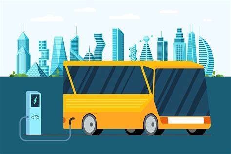Yellow electric bus charging beside a city skyline.